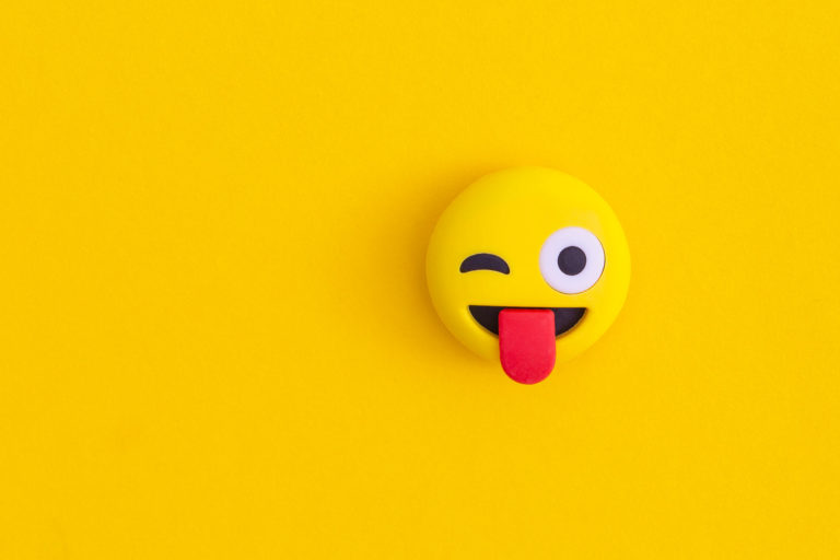 A smily face icon on a yellow background