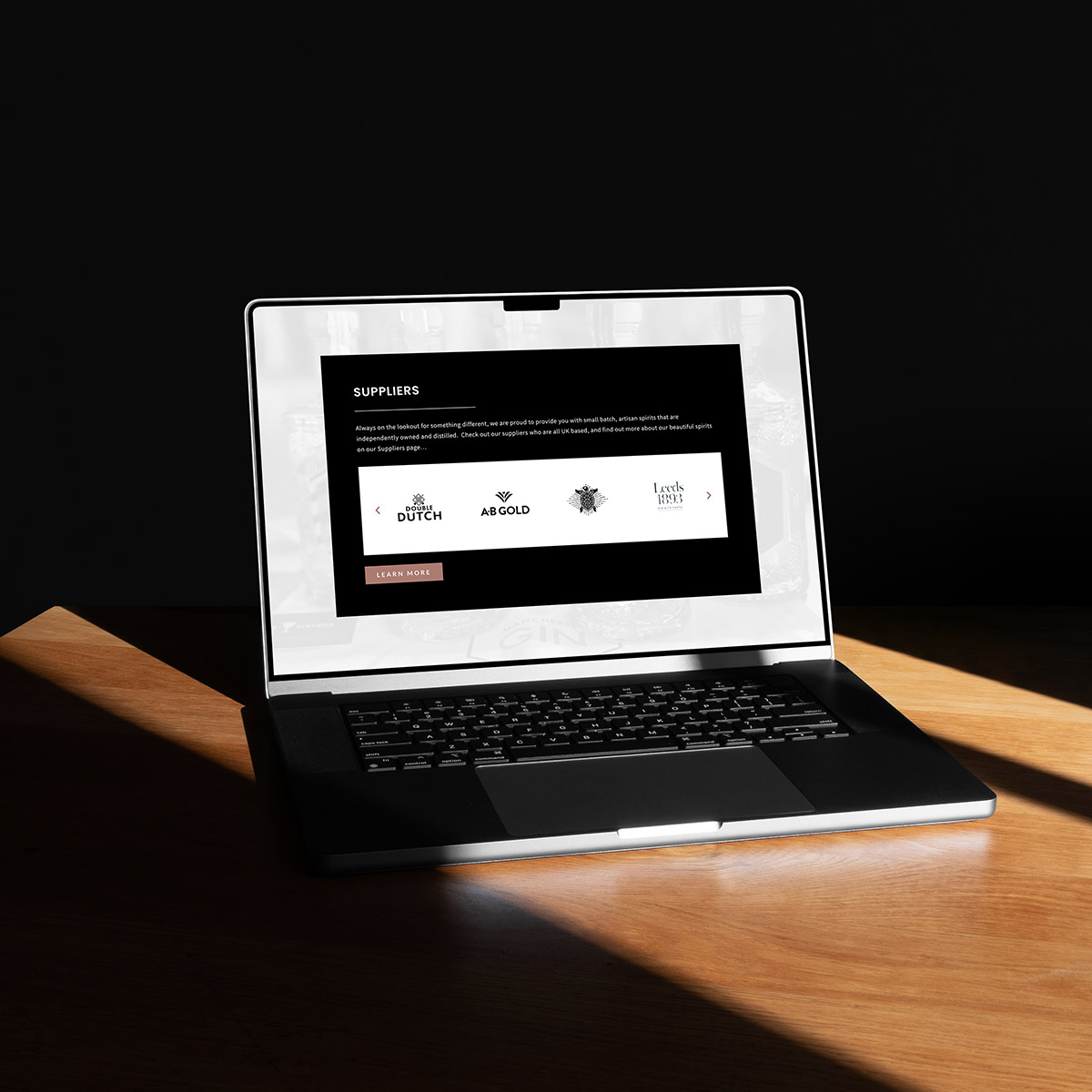 A mockup of a website design being shown on a laptop